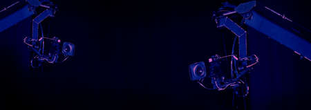 TV Camera broadcast on the crane tripod for shooting or recording and broadcasting content in studio production to on air tv or online internet live show. HD Video recording on crane. Selective focus.の写真素材