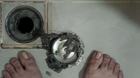 Drain cleaning. Clogged and dirty sewer pipes floor drain. Full of hair and accumulated clogged...