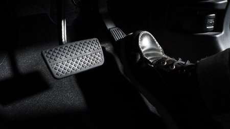 Accelerate and Brake. Foot pressing foot pedal of a car to drive ahead. Accelerator and brake pedal in a car. Driver driving the car by pushing accelerator pedals of the car. inside vehicle automobileの写真素材