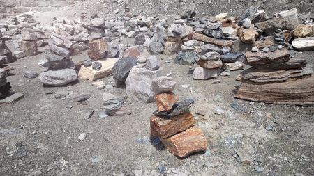 Stack of stones on top of the mountain. Pile of rocks stone and mountains. Balanced stone pyramid or...