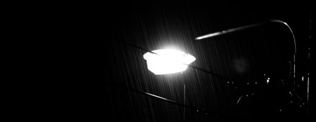 Raining Night and light. Rain Drops Falling in night at Bangkok Thailand in August raining season....