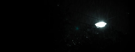 Raining Night and light. Rain Drops Falling in night at Bangkok Thailand in August raining season....