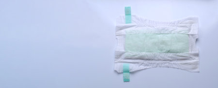 Diaper open type for baby isolated white background and copy space. Baby diaper dry and soft texture fabric white color hygienic and comfortable tape type and white background studio shotの写真素材