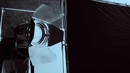 Film light for video production camera in studio set. Use as studio photo shoot light. Big LED spot light 5000w and diffuser or black panel create light like sun light can make daytime or golden hourの写真素材