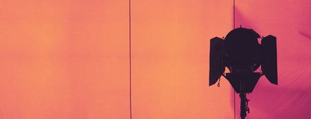 Film light for video production camera in studio set. Use as studio photo shoot light. Big LED spot light 5000w and diffuser or black panel create light like sun light can make daytime or golden hourの写真素材