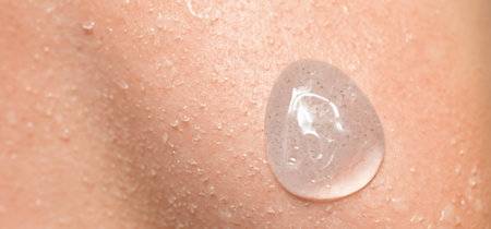 Collagen And Hyaluron Serum Gel On Skin. Splashing of Hyaluron gel. Liquid hyaluronic acid gel on...