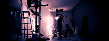 Photo or Video production studio with professional equipment preparation before shooting. Studio LED continuous lights arranging behind diffuser plates for softer light to the product and background.の写真素材