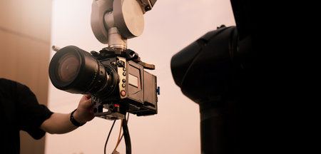 Video or film production with high tech robotic arm equipped with a professional cinema camera....
