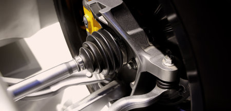 Car suspensions. Close up of a car suspension parts system such as CV joint Rubber boot and Control arms bushing Steering rack axles Shock absorber suspension Brake. Repair and spare parts for cars.の写真素材