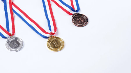 Gold silver and bronze demonstration trophy medals with ribbon for school university or national or olympic sport even organization competition. Isolated on white background. Award and victory conceptの写真素材