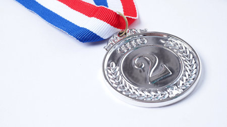 Gold silver and bronze demonstration trophy medals with ribbon for school university or national or olympic sport even organization competition. Isolated on white background. Award and victory conceptの写真素材