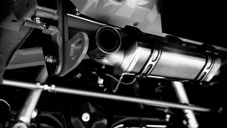 Car suspension part. Close up of a rear car suspension and exhaust system. such as coil springs link arms axle housing and performance exhaust. For auto engineering or car suspension part industry useの写真素材