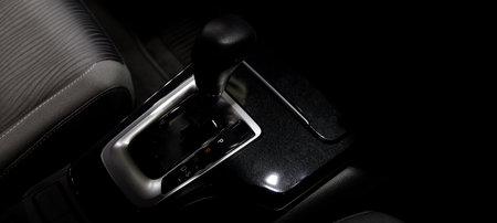 Car gear. Close up of modern car automatic gear selector or electronic shifter. Premium interior design EV car gears driving control. auto transmission modes. Automotive technology in motion driving.の写真素材
