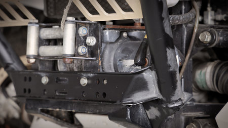 Old car suspensions. Close up car suspension wear and tear parts. CV joint Rubber boot and Control arms bushing Steering rack axles Shock absorber Brake exhaust. Gas Diesel car service repair parts.の写真素材