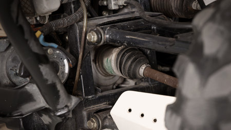 Old car suspensions. Close up car suspension wear and tear parts. CV joint Rubber boot and Control arms bushing Steering rack axles Shock absorber Brake exhaust. Gas Diesel car service repair parts.の写真素材