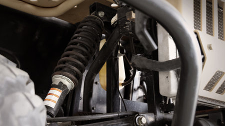 Old car suspensions. Close up car suspension wear and tear parts. CV joint Rubber boot and Control arms bushing Steering rack axles Shock absorber Brake exhaust. Gas Diesel car service repair parts.の写真素材