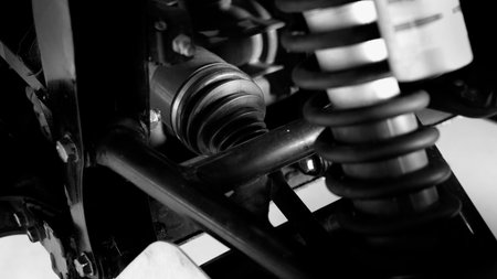 Old car suspensions. Close up car suspension wear and tear parts. CV joint Rubber boot and Control arms bushing Steering rack axles Shock absorber Brake exhaust. Gas Diesel car service repair parts.の写真素材