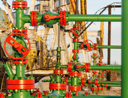 Group of wellheads. Oilfield during winter time. Oil and gas concept.の写真素材