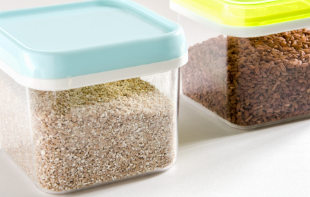 Food storage. Food ingredients (cut wheat and barley) in plastic containers. Selective focus.の写真素材