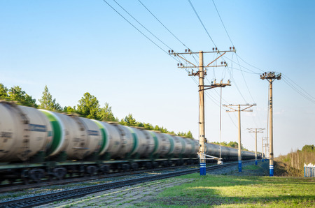 Train with oil tanks moving. Transportation of fuel on the railroad. Motion blur.の写真素材