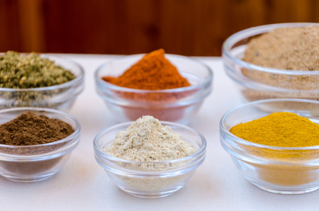 Different kind of colorful spices powder in glass bowls. Food and cuisine additives.の写真素材