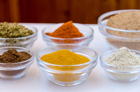 Different kind of colorful spices powder in glass bowls. Food and cuisine additives.の写真素材