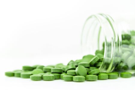 Medical pills placed on rotating table, shot with white seamlessの写真素材