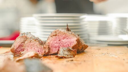 Freshly sliced sirloin meat on the wooden tableの写真素材