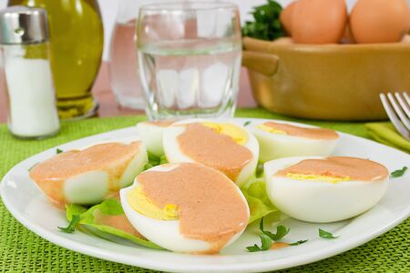 boiled eggs served with cocktail sauceの写真素材