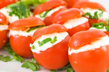 tomatoes stuffed with cheese の写真素材