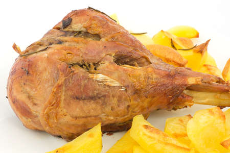 leg of turkey with baked potatoes の写真素材