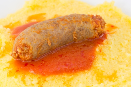 polenta with tomato sauce with sausage の写真素材