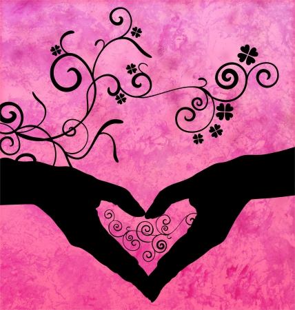 black silhouette of hands shaping heart with flourishesの写真素材