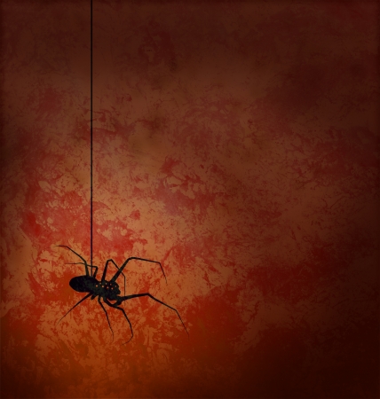 textured red background with spider silhouette horror imageの写真素材