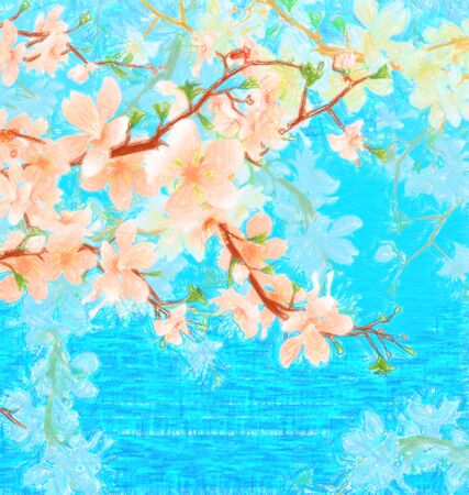 blossoming tree brunch in the garden on the blue sky backgroundの写真素材