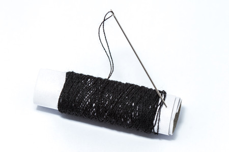 Needle and thread, isolated on white background.の写真素材