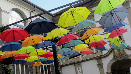 Colorful Umbrellas Hanging from a Frameworkの写真素材