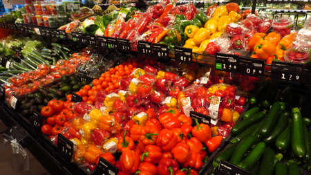 Vegetable Section in Supermarket with Cucumbers, Tomatoes and Moreの写真素材