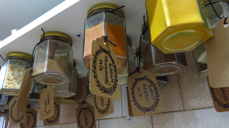 Herbs and Spices Hanging From Shelfの写真素材
