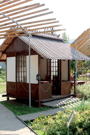 Sculpture, pond and path in the restaurant under the open skyの写真素材