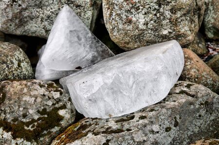 Ice floes, which lie on the coastal stonesの写真素材