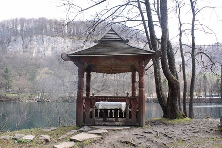 Arbour ashore the Blue lake in the mountains of Caucasusの写真素材