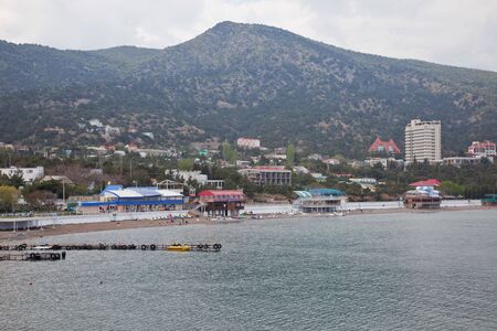 Crimea. Bank of the Black sea near a settlement New lightの写真素材