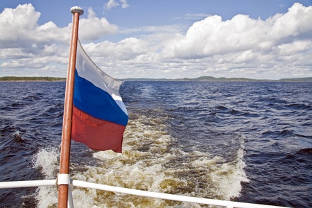 Russian flag on the background of Lake Onegaの写真素材