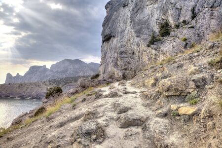 Pedestrian path on a mountain along with the coast of seaの写真素材
