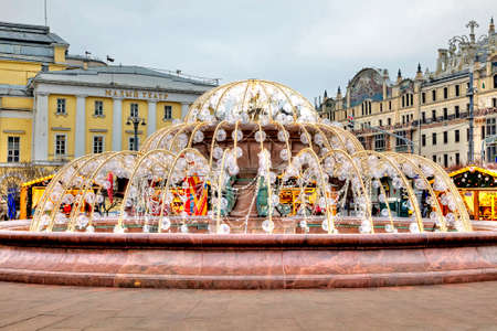 Big balls decorated with festive lights fountain in downtown Moscowのeditorial素材