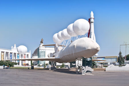 RUSSIA, MOSCOW - May 28,2014: Exhibition of Achievements of the People's Economy (VDNKh). Artistic installation, bandaged airplane with balloons on a background exhibition pavilionsのeditorial素材