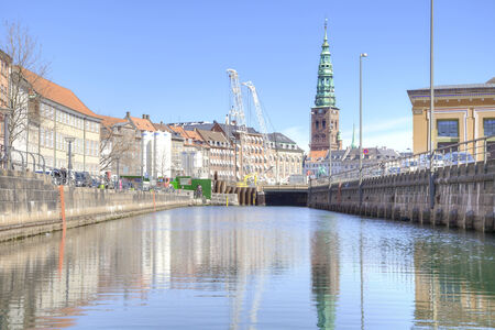 DENMARK, COPENHAGEN - May 02.2013: A beautiful channel is in city. Building and ancient houses ashoreのeditorial素材