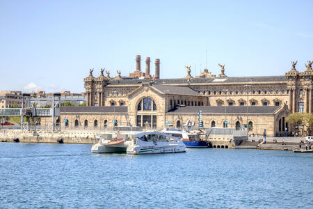 SPAIN, BARCELONA - May 5.2014: Ancient customs building on the shore of the bayのeditorial素材