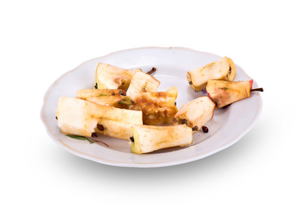 Eaten ripe apples isolated on a white backgroundの写真素材